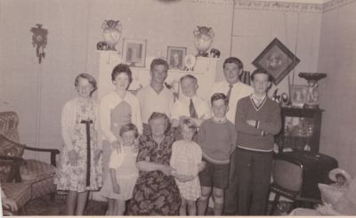 1958 Maud with most of her grandchildren - Lois, Maureen Millard, Bernard McMahon, Neil, John Millard, Brian Millard (with arms folded), Robyn Millard (in front of Maureen), Maud, Bev and Gary Millard
