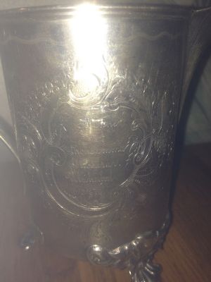 1870 - silver can gift given to tutor E. Eriksson by grateful parents in Ulriksdal
Hakan Eriksson has taken these two photos of a silver vase which are engraved in Swedish bon both front and back sides. The front side says "To Schoolteacher E. Eriksson". The back side says "Memory of grateful parents Ulriksdal 1870". Inside is some writing by Ragnhild Eriksson which says "Gift from Drottningholm". We know he taught at two different Swedish castles - Ulriksdal and Drottningholm).

