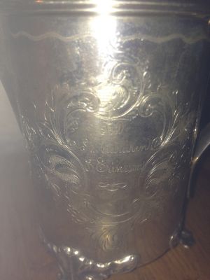 1870 - silver can gift given to tutor E. Eriksson by grateful parents in Ulriksdal
Hakan Eriksson has taken these two photos of a silver vase which are engraved in Swedish bon both front and back sides. The front side says "To Schoolteacher E. Eriksson". The back side says "Memory of grateful parents Ulriksdal 1870". Inside is some writing by Ragnhild Eriksson which says "Gift from Drottningholm". We know he taught at two different Swedish castles - Ulriksdal and Drottningholm).
